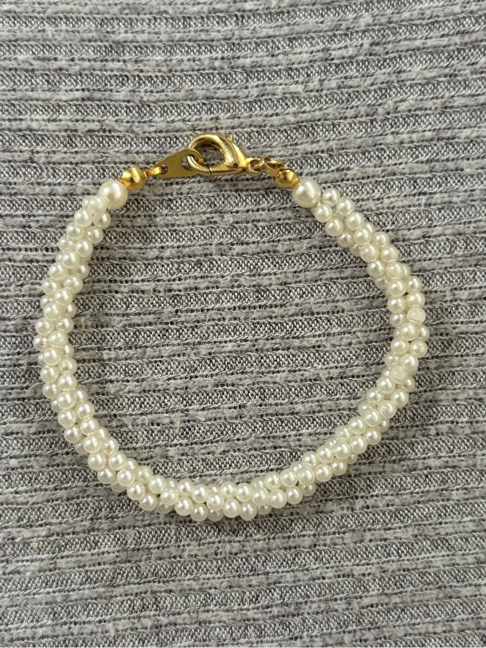 Vintage gold tone clasped, twisted faux pearl bracelet